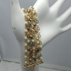 Ali Khan beaded bracelet with gold links. color pearl-opal-hematite-champagne